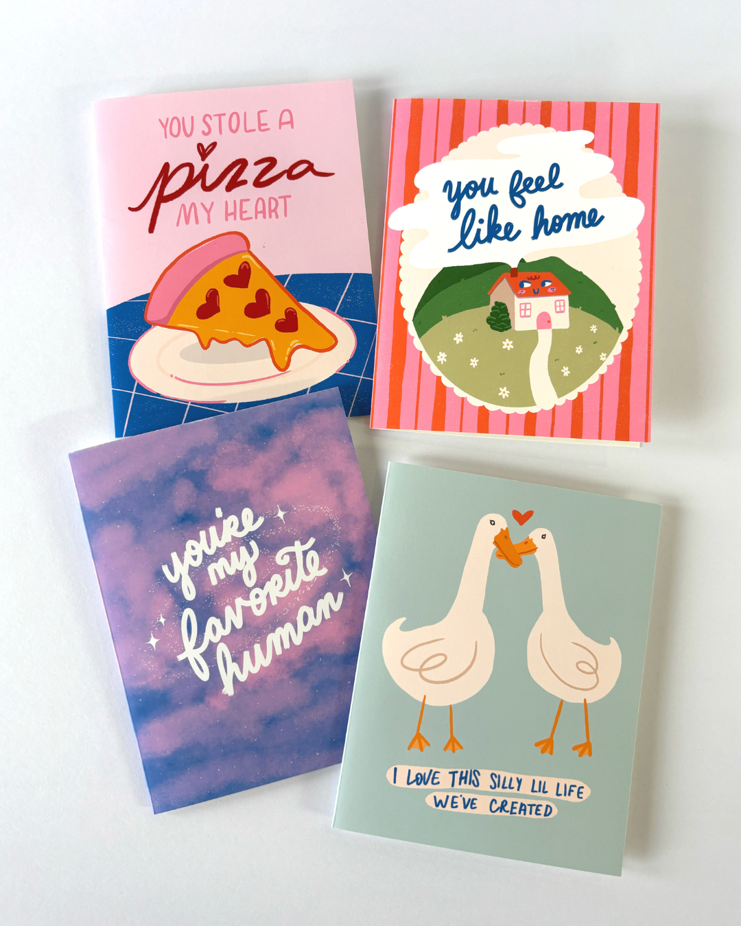 four colorful greeting cards from the collection
