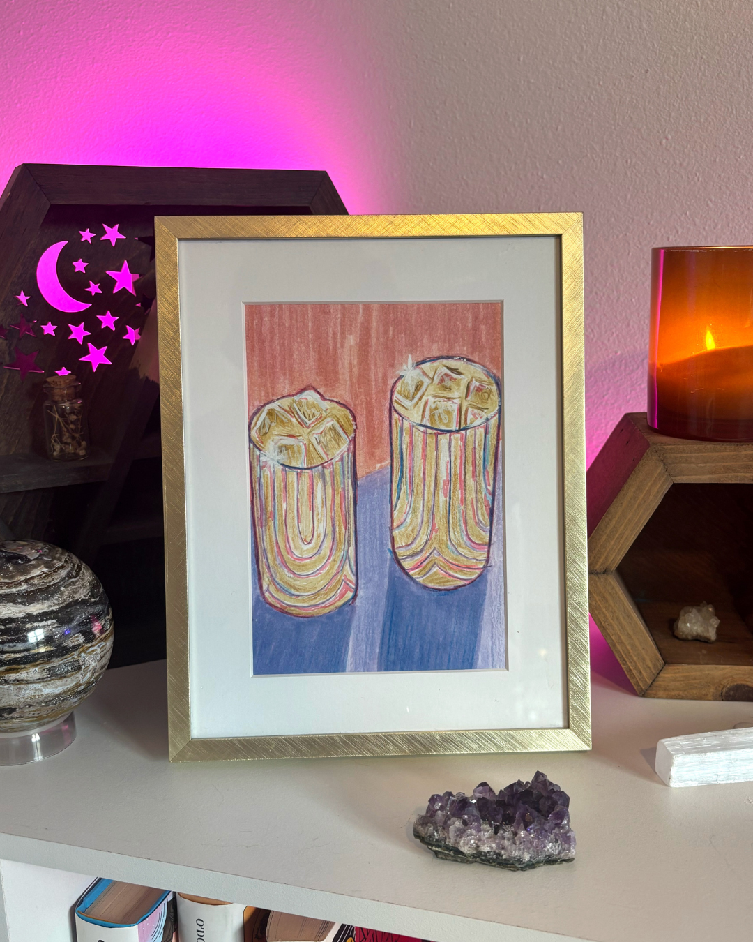 Artwork of two colorful abstract glass shapes on a pink and purple background.