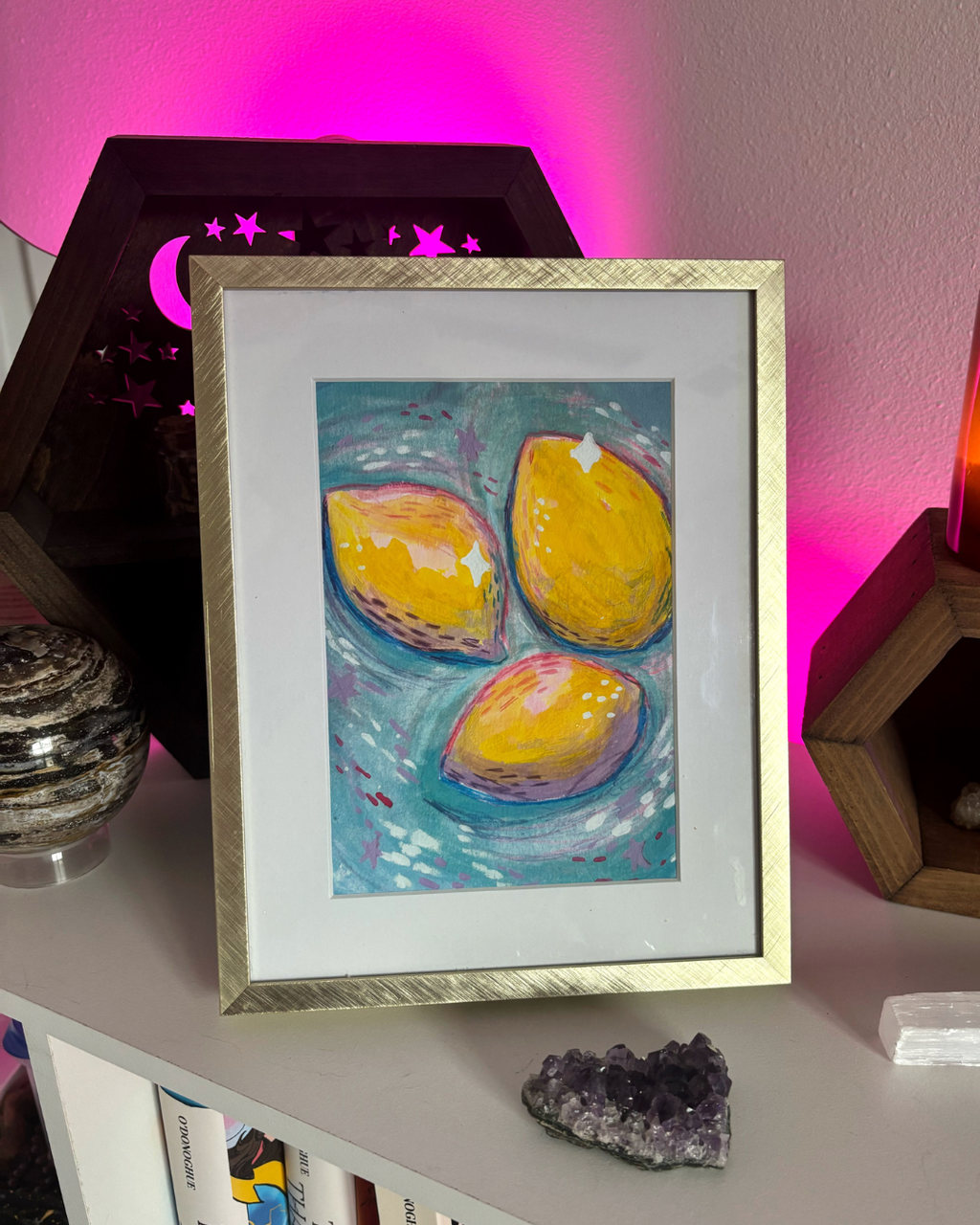 Art print of 3 painterly lemons on a blue background with pink and purple abstract elements and stars.